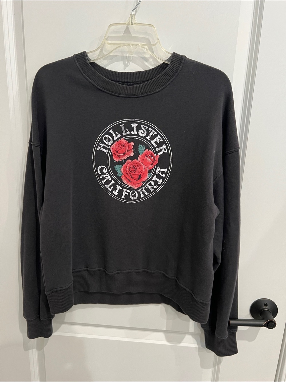 Hollister Black Pullover Sweatshirt with Pinkish Red Rose Emblem Size M